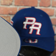 grey under visor on the Puerto Rico 2023 World Baseball Classic Grey Bottom Blue 9Forty Dad Hat