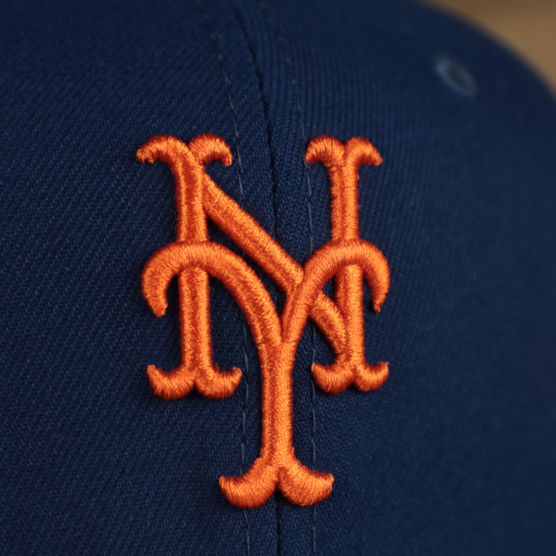 Close up of the New York Mets logo on the New York Mets "City Cluster" Side Patch Gray Bottom Royal 59Fifty Fitted Cap