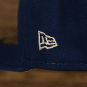 Close up of the New Era logo on the New York Mets "City Cluster" Side Patch Gray Bottom Royal 59Fifty Fitted Cap