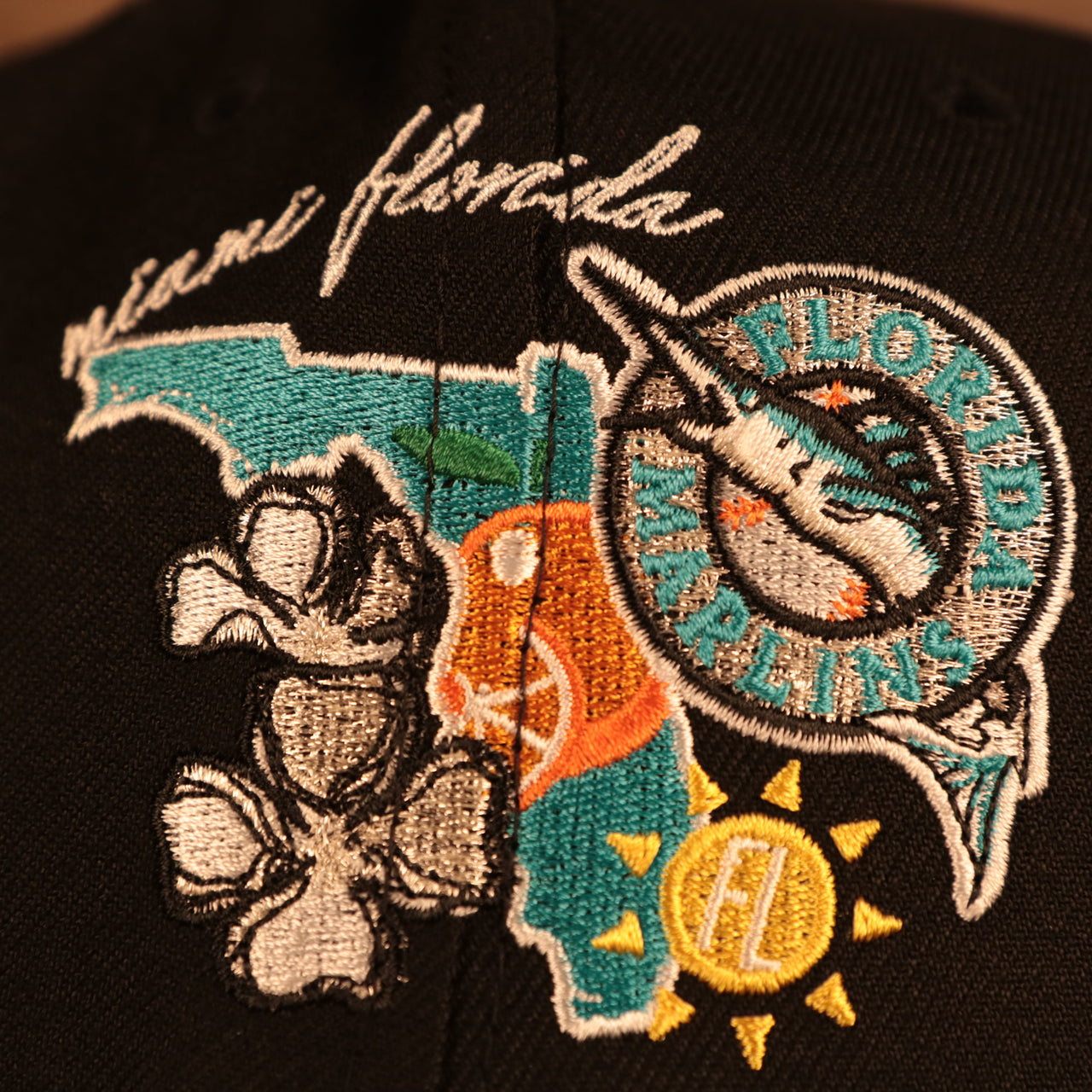 Close up of the side patch of the Florida Marlins Cooperstown "City Cluster" Side Patch Gray Bottom Black 59Fifty Fitted Cap