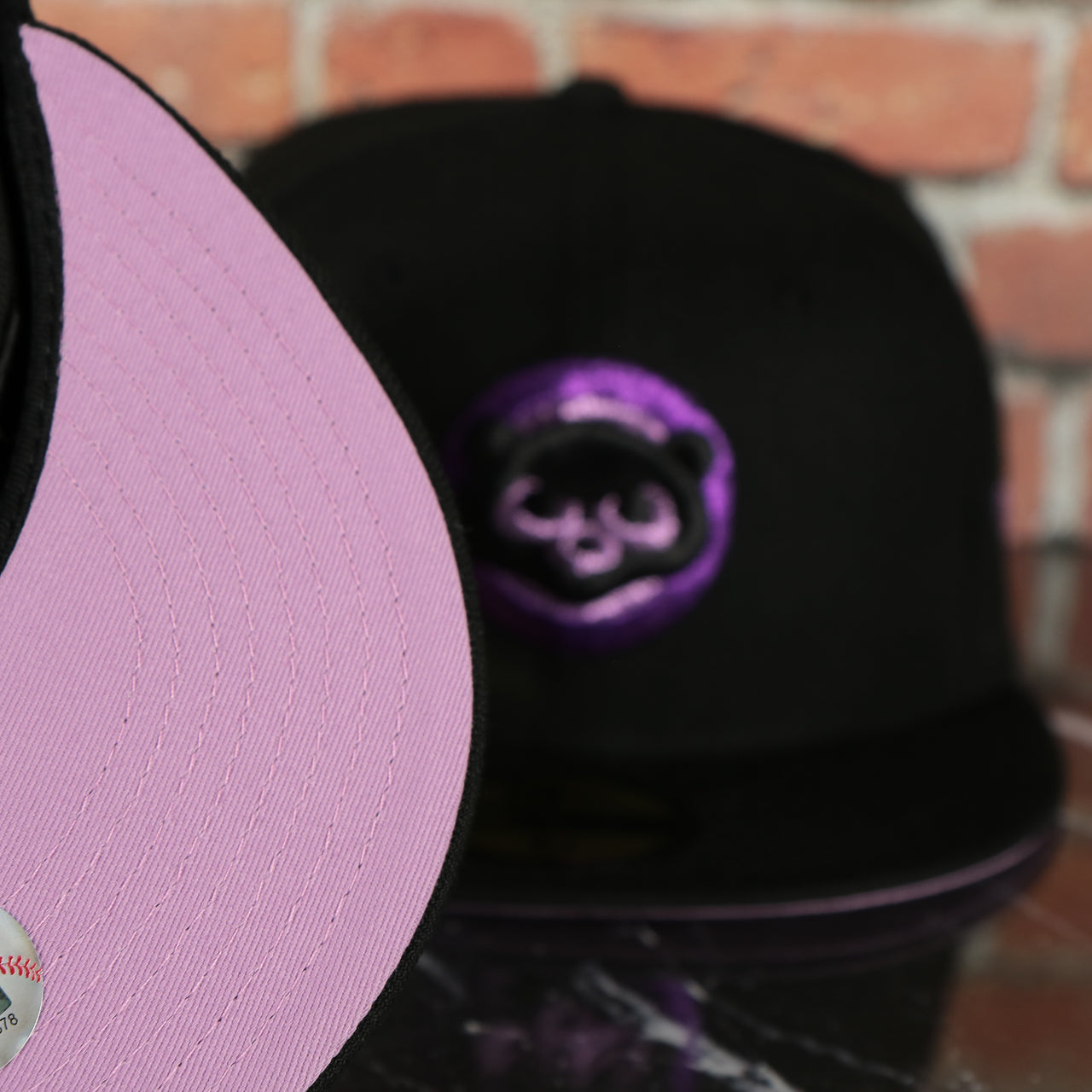 lavender under visor on the Chicago Cubs Cooperstown Metallic Pop Logo Lavender Bottom Black 59Fifty Fitted Cap