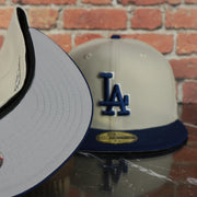 grey under visor on the Los Angeles Dodgers World Class 7-Time World Series Champions Two Tone Grey Bottom | Sand/Royal 59Fifty Fitted Cap