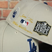 back side of the Los Angeles Dodgers World Class 7-Time World Series Champions Two Tone Grey Bottom | Sand/Royal 59Fifty Fitted Cap