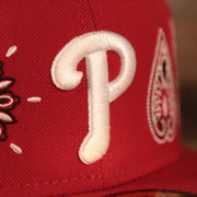 Close up of the Philadelphia Phillies logo on the Philadelphia Phillies Paisley Elements Bandana Retro Green Bottom 59Fifty Fitted Cap