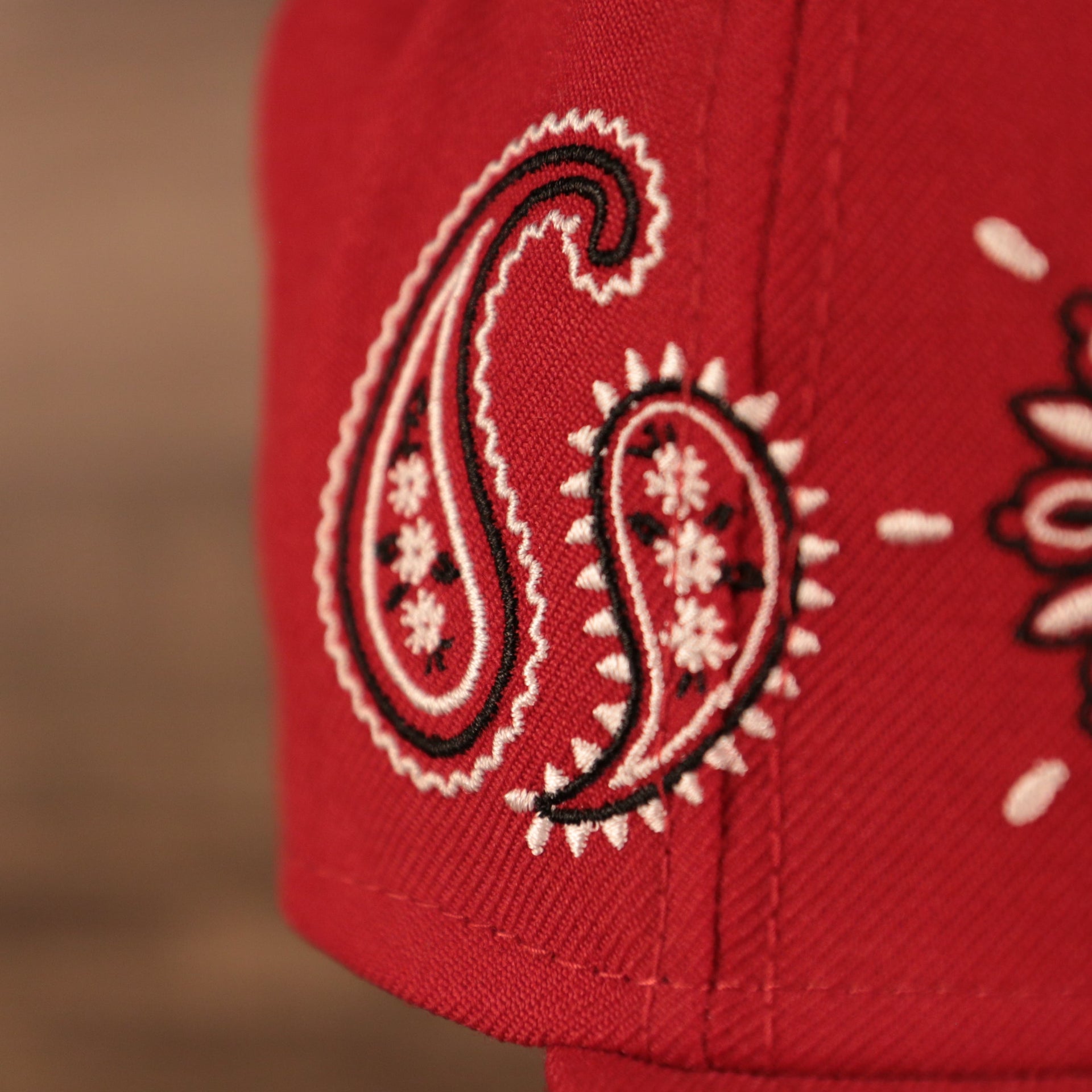 Close up of swirling teardrops from the bandana paisley pattern embroidered on the Philadelphia Phillies Paisley Elements Bandana Retro Green Bottom 59Fifty Fitted Cap