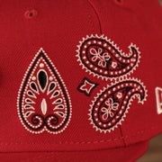 Close up of the bandana paisley pattern embroidered on the wearer's front left of the Philadelphia Phillies Paisley Elements Bandana Retro Green Bottom 59Fifty Fitted Cap