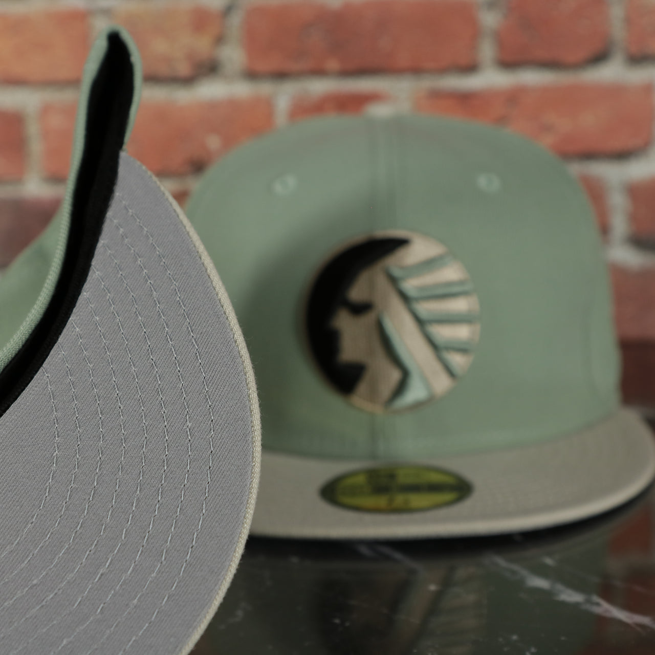 grey under visor on the Memphis Chicks Hometown Roots Two Tone Grey Bottom Light Sage/Sand 59Fifty Fitted Cap