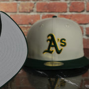 grey under visor on the Oakland Athletics World Class 9-Time World Series Champions Two Tone Grey Bottom | Sand/Green 59Fifty Fitted Cap