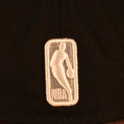 Close up of the NBA logo of the Brooklyn Nets "City Cluster" Side Patch Gray Bottom Black 59Fifty Fitted Cap
