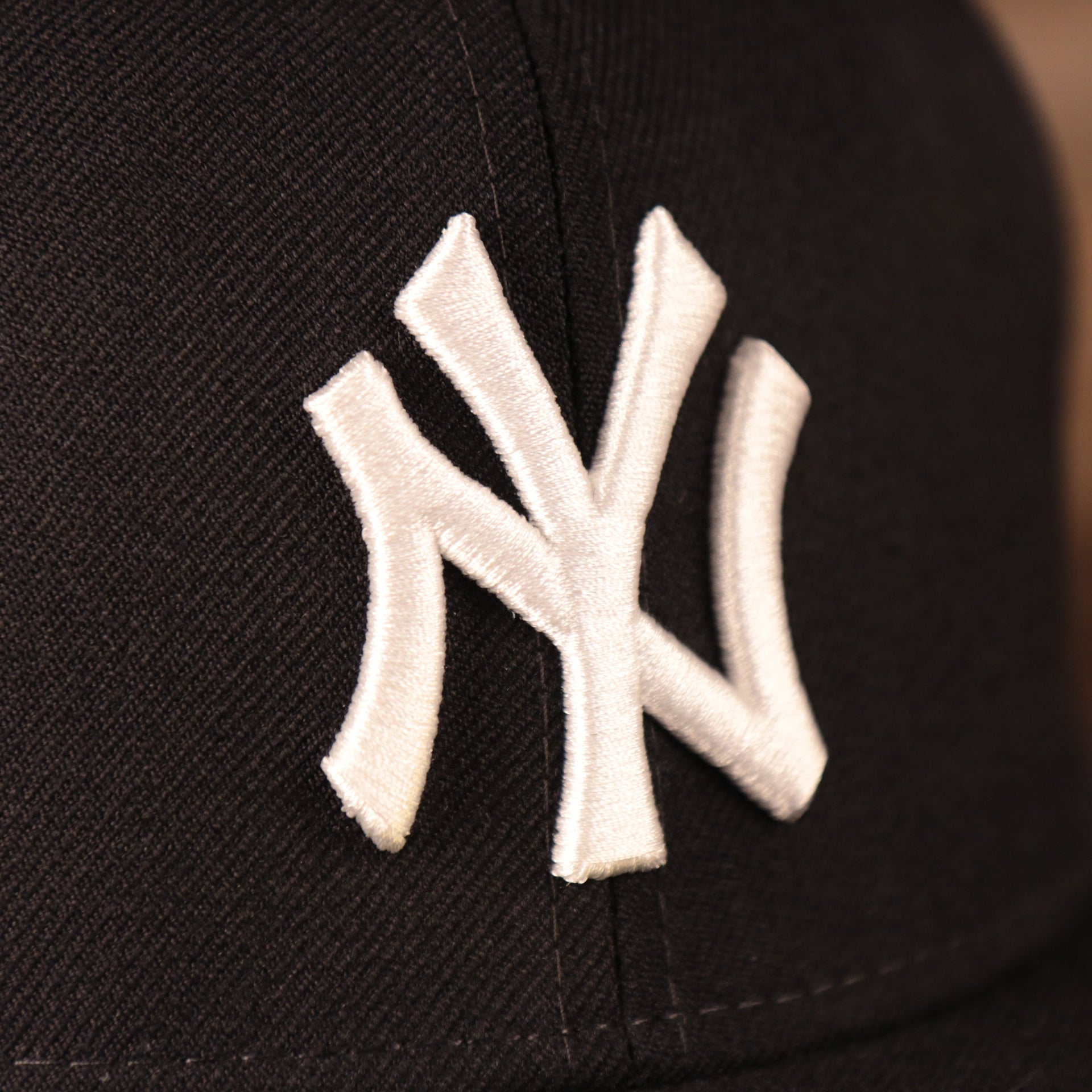 Close up of the New York Yankees logo on the New York Yankees 2008 All Star Game Crystal Side Patch Icy Blue Bottom 59Fifty Fitted Cap