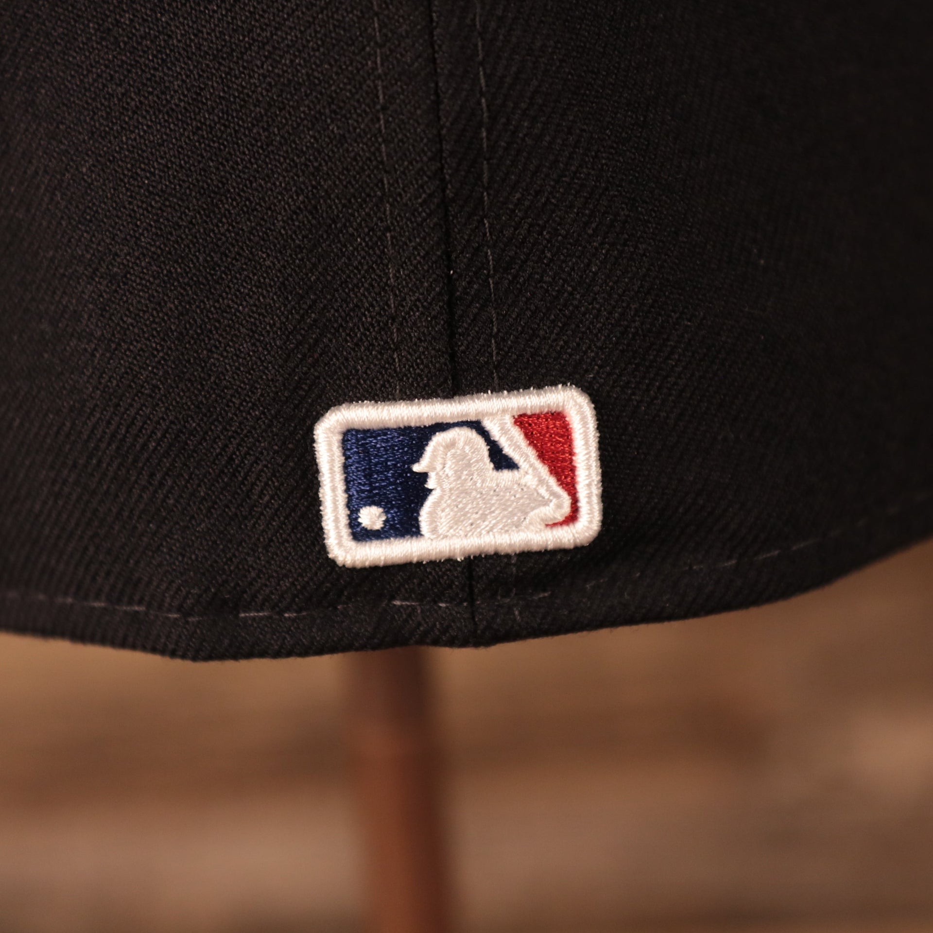 Close up of the MLB Batterman logo on the New York Yankees 2008 All Star Game Crystal Side Patch Icy Blue Bottom 59Fifty Fitted Cap