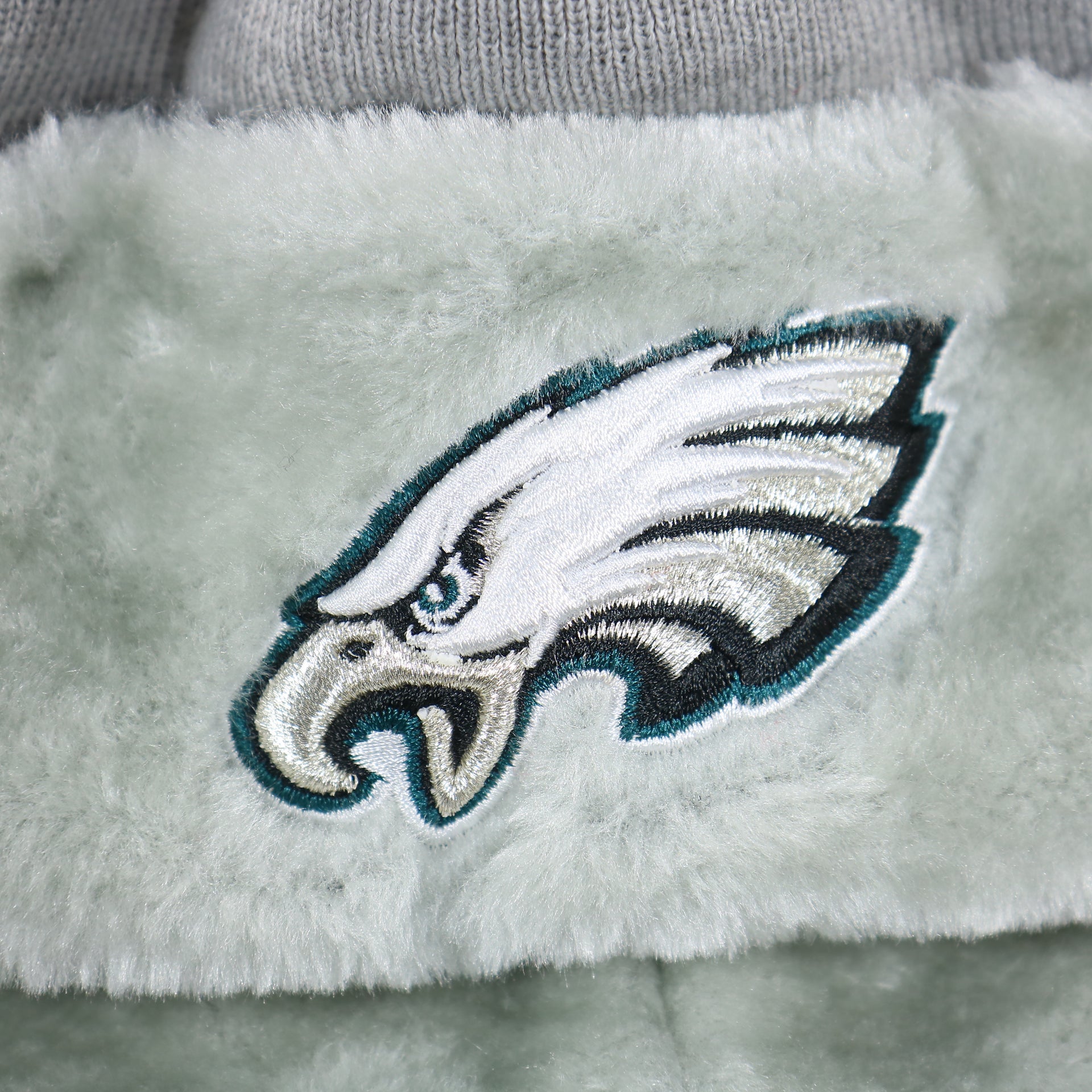 The Eagles Logo on the Philadelphia Eagles Logo Wrapped Around Wordmark Trapper Hat | Gray Ushanka Hat