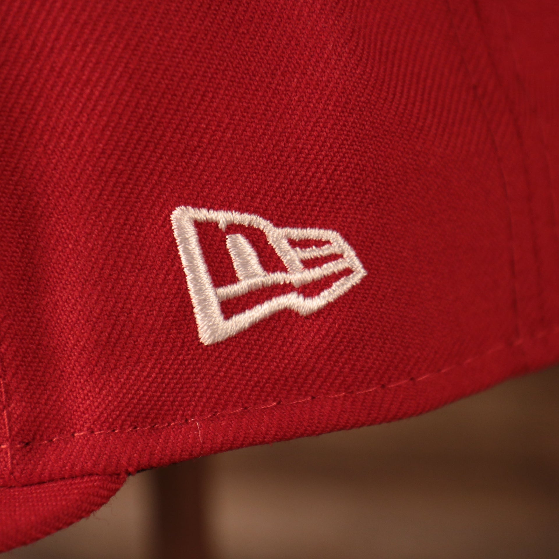 Close up of New Era logo on the Philadelphia Phillies All Over World Series Side Patch 2x Champ Gray Bottom 59Fifty Fitted Cap