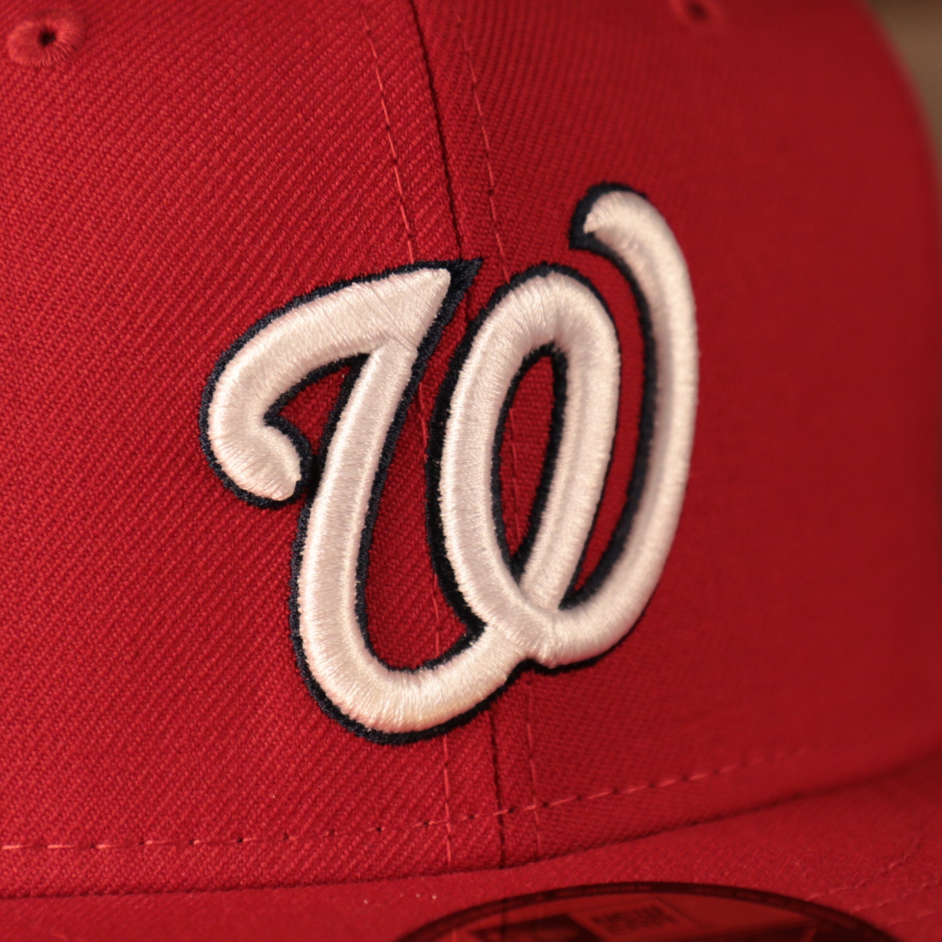Close up of the Nationals logo on the front of the Washington Nationals 2019 World Series Champ Script Gray Bottom Side Patch 59Fifty Fitted Cap