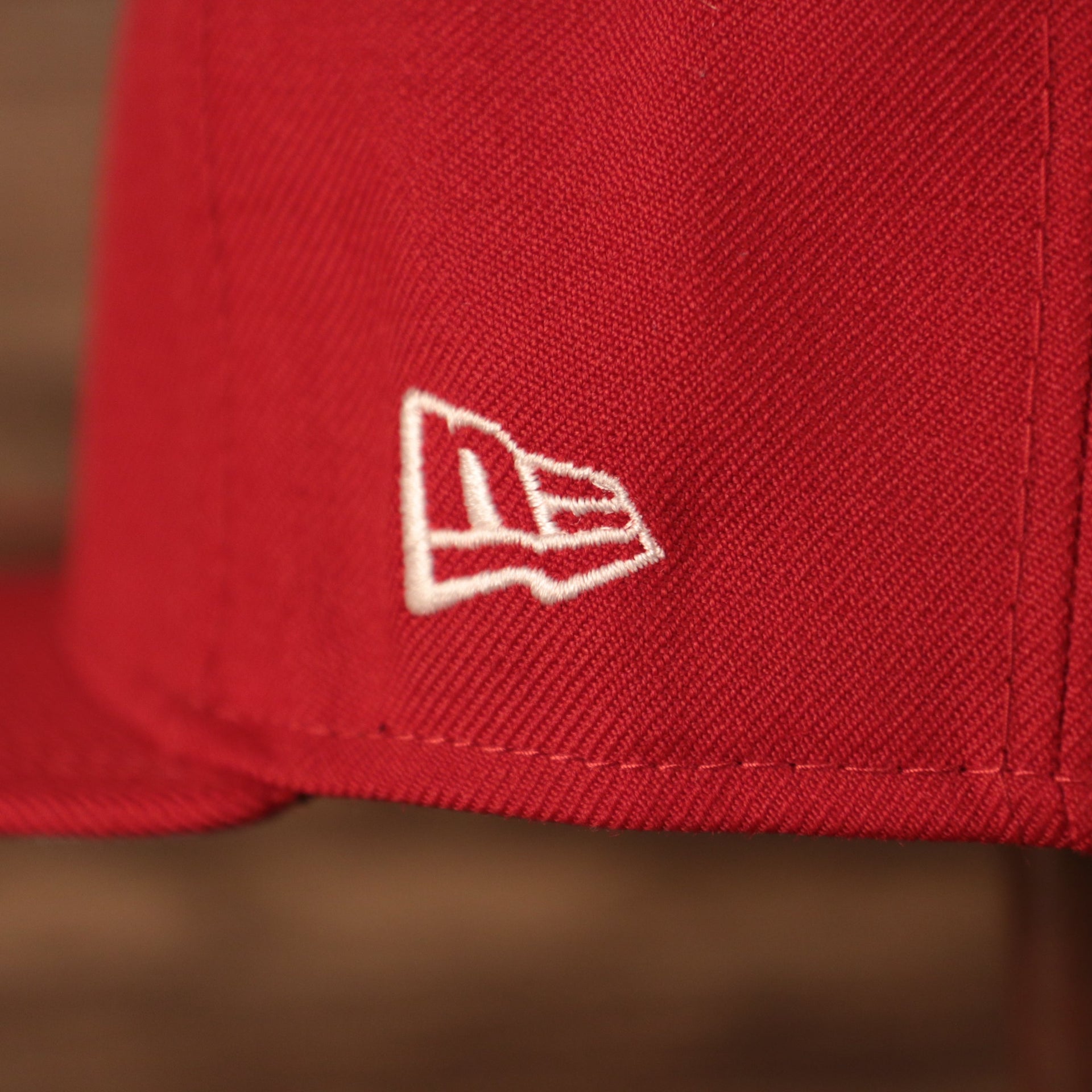 Close up of the New Era flag on the Washington Nationals 2019 World Series Champ Script Gray Bottom Side Patch 59Fifty Fitted Cap