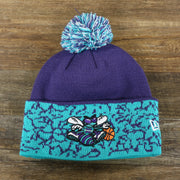 The front of the Retro Charlotte Hornets Cuffed Chaos Pom Pom Beanie | Purple And Light Blue Winter Beanie