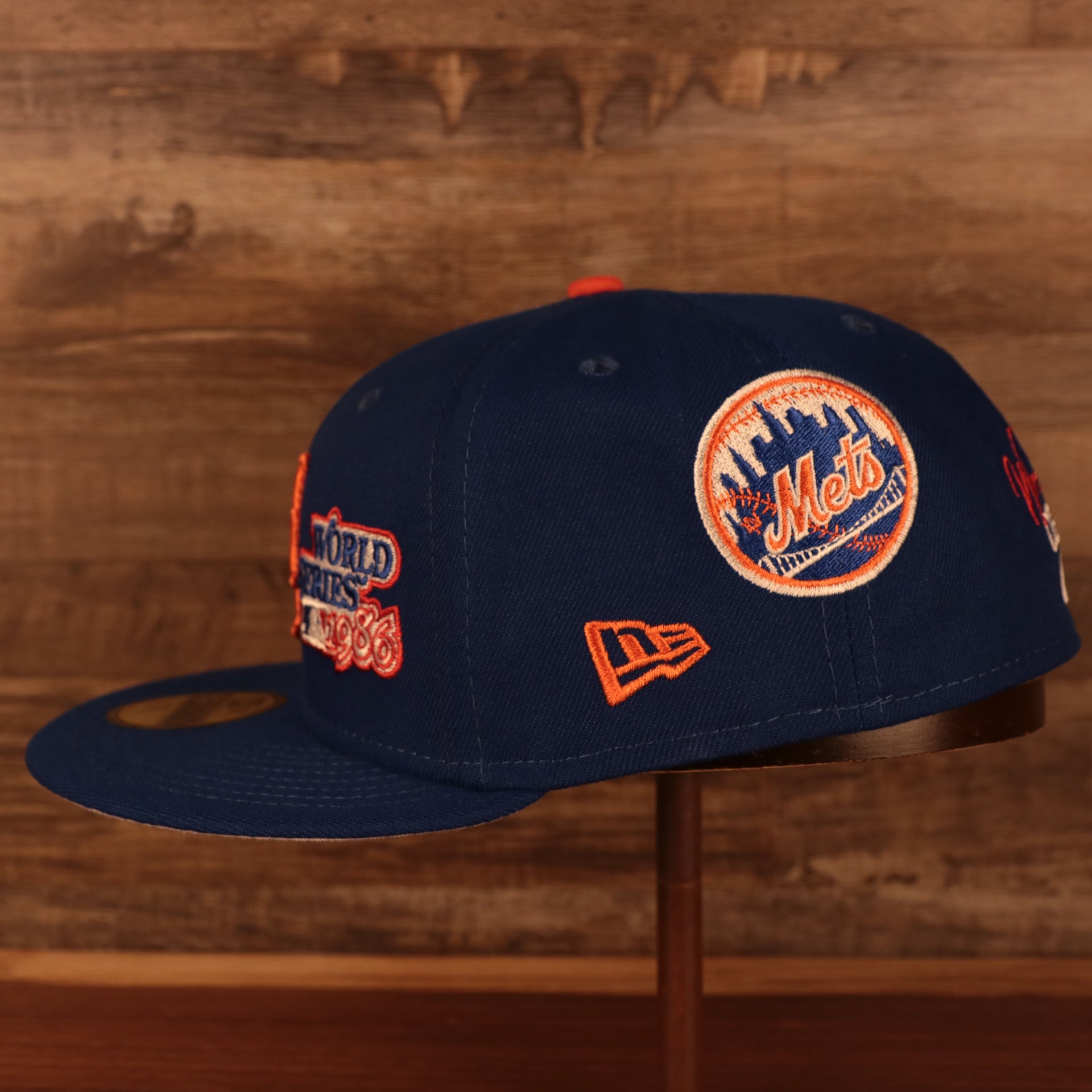 right side view of the New York Mets Cooperstown "Championship Rings" All Over Side Patch Gray Bottom 59FIFTY Fitted Cap