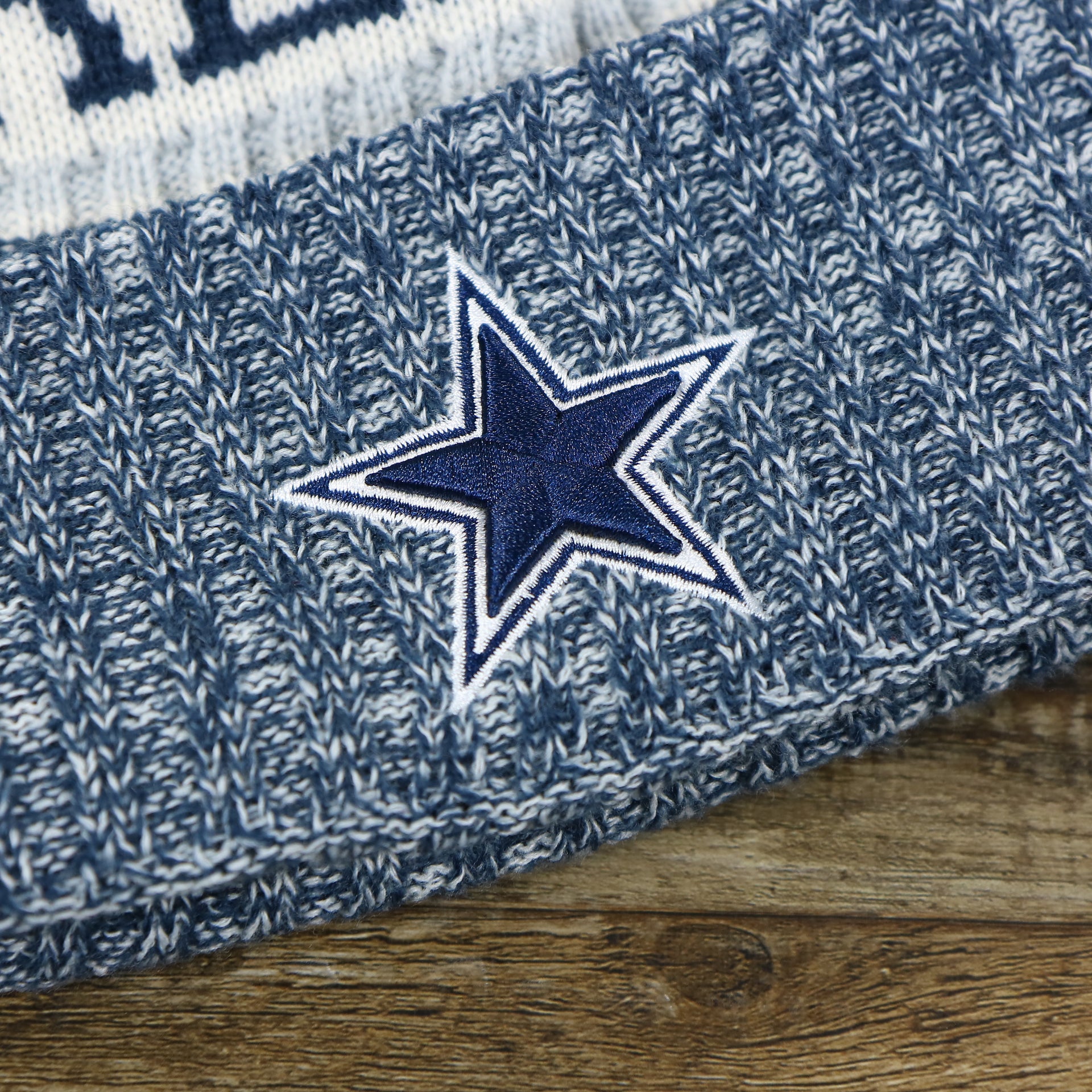 The Cowboys Logo on the Dallas Cowboys On Field Cuffed Fisherman Knit Beanie | Navy Blue Winter Beanie