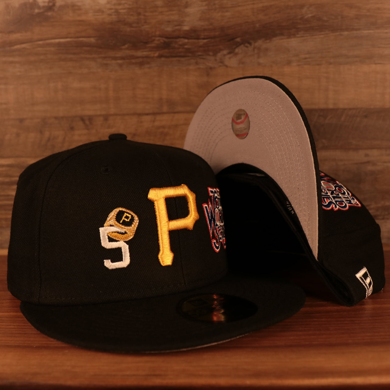 front and bottom of the Pittsburgh Pirates Cooperstown "Championship Rings" All Over Side Patch Gray Bottom 59FIFTY Fitted Cap