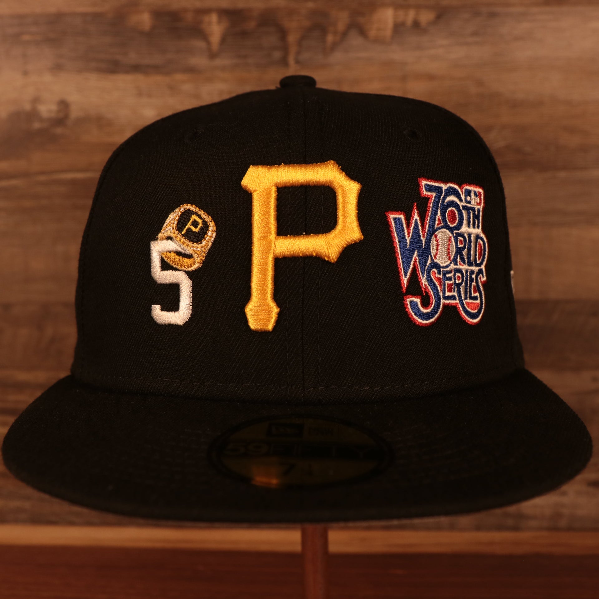 front of the Pittsburgh Pirates Cooperstown "Championship Rings" All Over Side Patch Gray Bottom 59FIFTY Fitted Cap