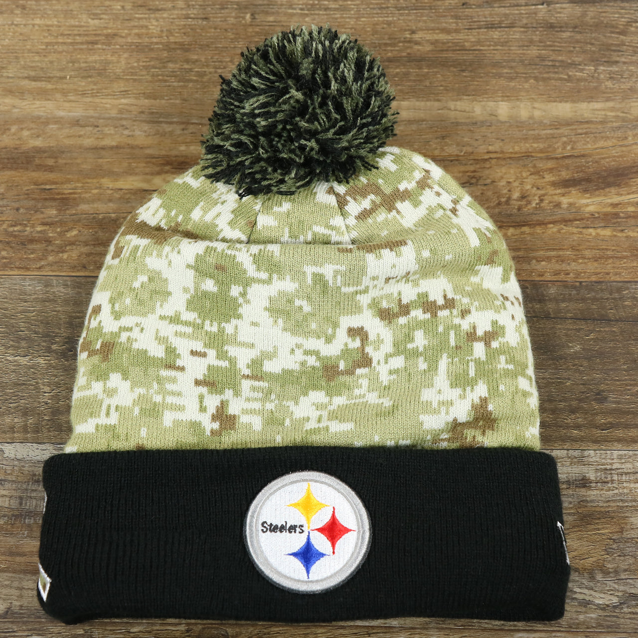 The front of the Pittsburgh Steelers NFL Salute To Service Cuffed Winter Beanie | Camo and Black Beanie