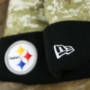 The New Era Logo on the Pittsburgh Steelers NFL Salute To Service Cuffed Winter Beanie | Camo and Black Beanie