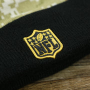The NFL Logo on the Pittsburgh Steelers NFL Salute To Service Cuffed Winter Beanie | Camo and Black Beanie