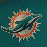 dolphins logo on the Miami Dolphins "Patch Up" 1993 Pro Bowl Side Patch Gray Bottom 59Fifty Teal Fitted Cap