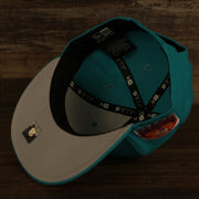 under visor view on the Miami Dolphins "Patch Up" 1993 Pro Bowl Side Patch Gray Bottom 59Fifty Teal Fitted Cap