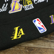 The Lakers Logo and the NBA Jerry West Logo on the Los Angeles Lakers All Over NBA Finals Side Patch 17x Champion Knit Cuff Beanie | New Era, Black