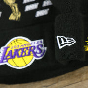 The New Era Logo on the Los Angeles Lakers All Over NBA Finals Side Patch 17x Champion Knit Cuff Beanie | New Era, Black