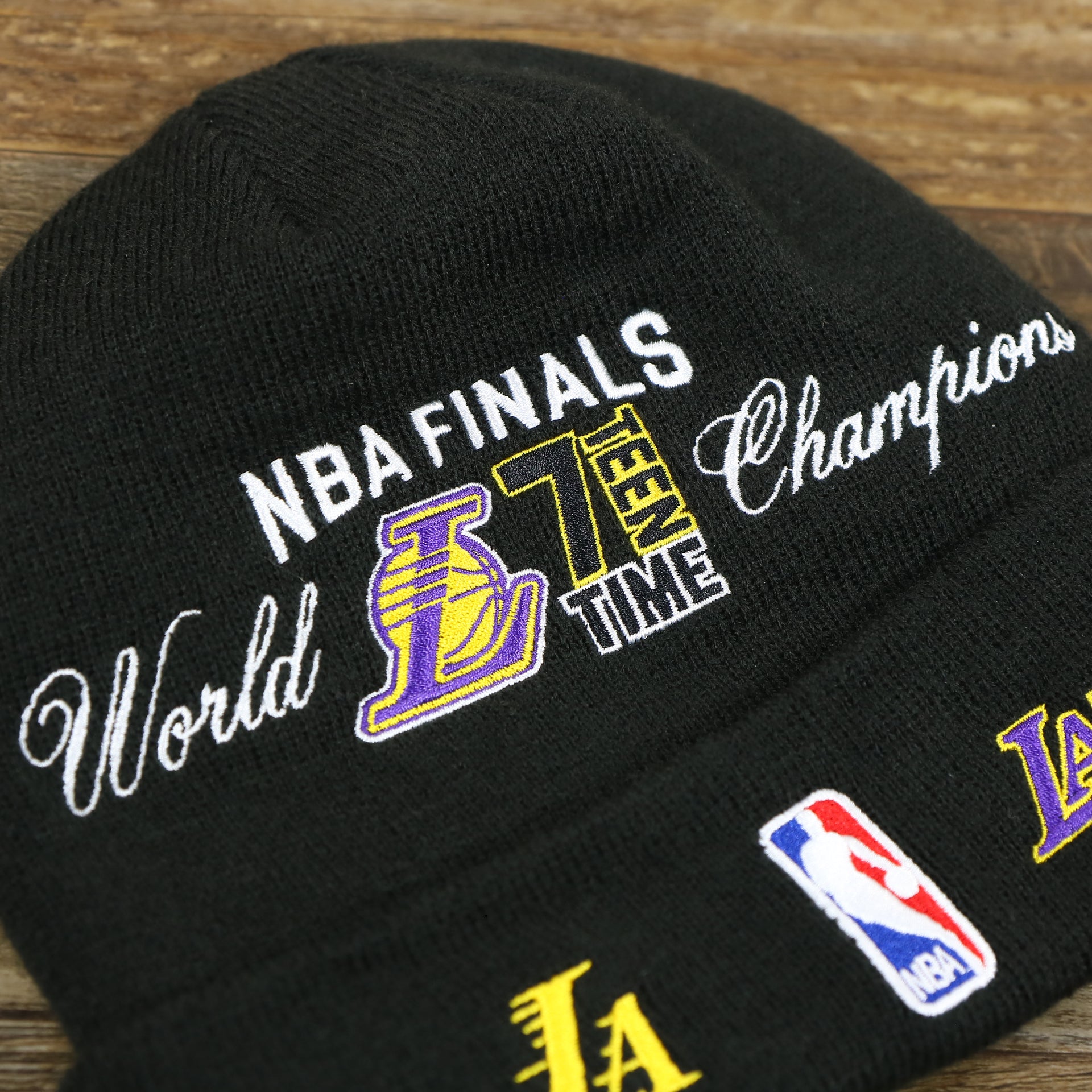 The NBA Finals 17 Time World Champions Wordmark on the Los Angeles Lakers All Over NBA Finals Side Patch 17x Champion Knit Cuff Beanie | New Era, Black