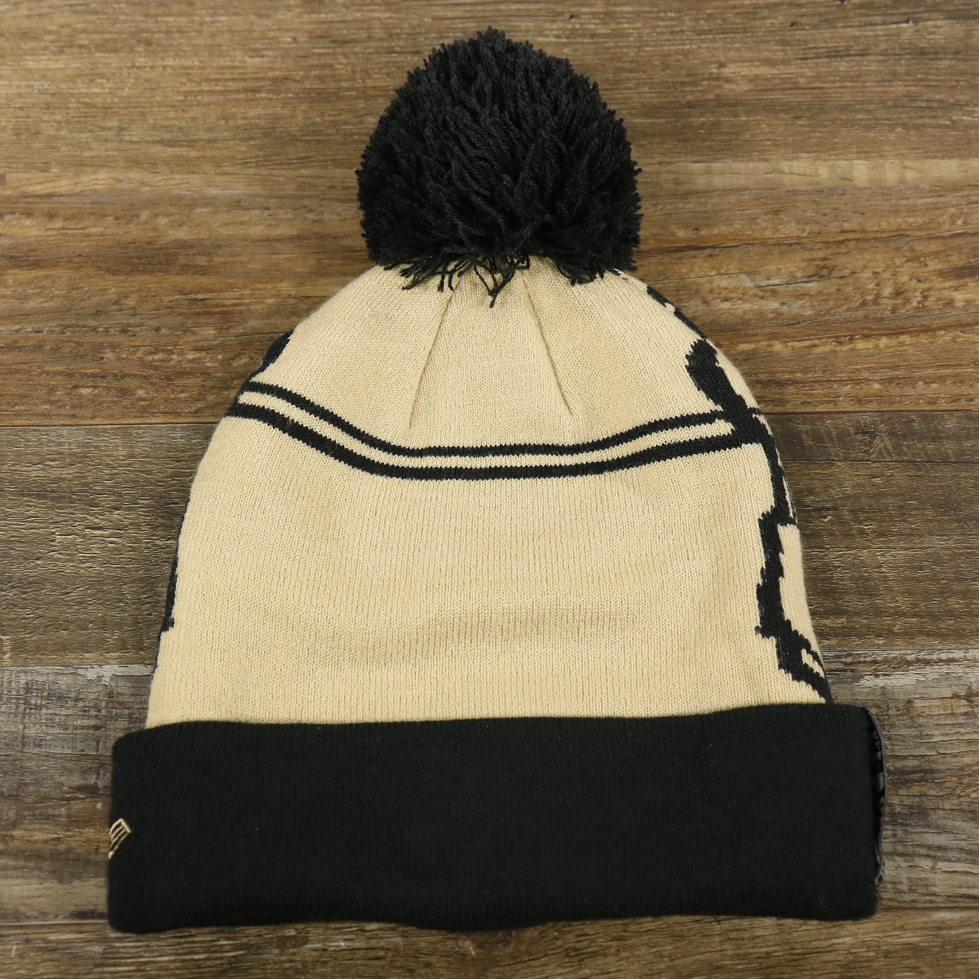 The backside of the Star War Sandtrooper Cuffed Beanie With Black Pom Pom | Tan And Black Beanie