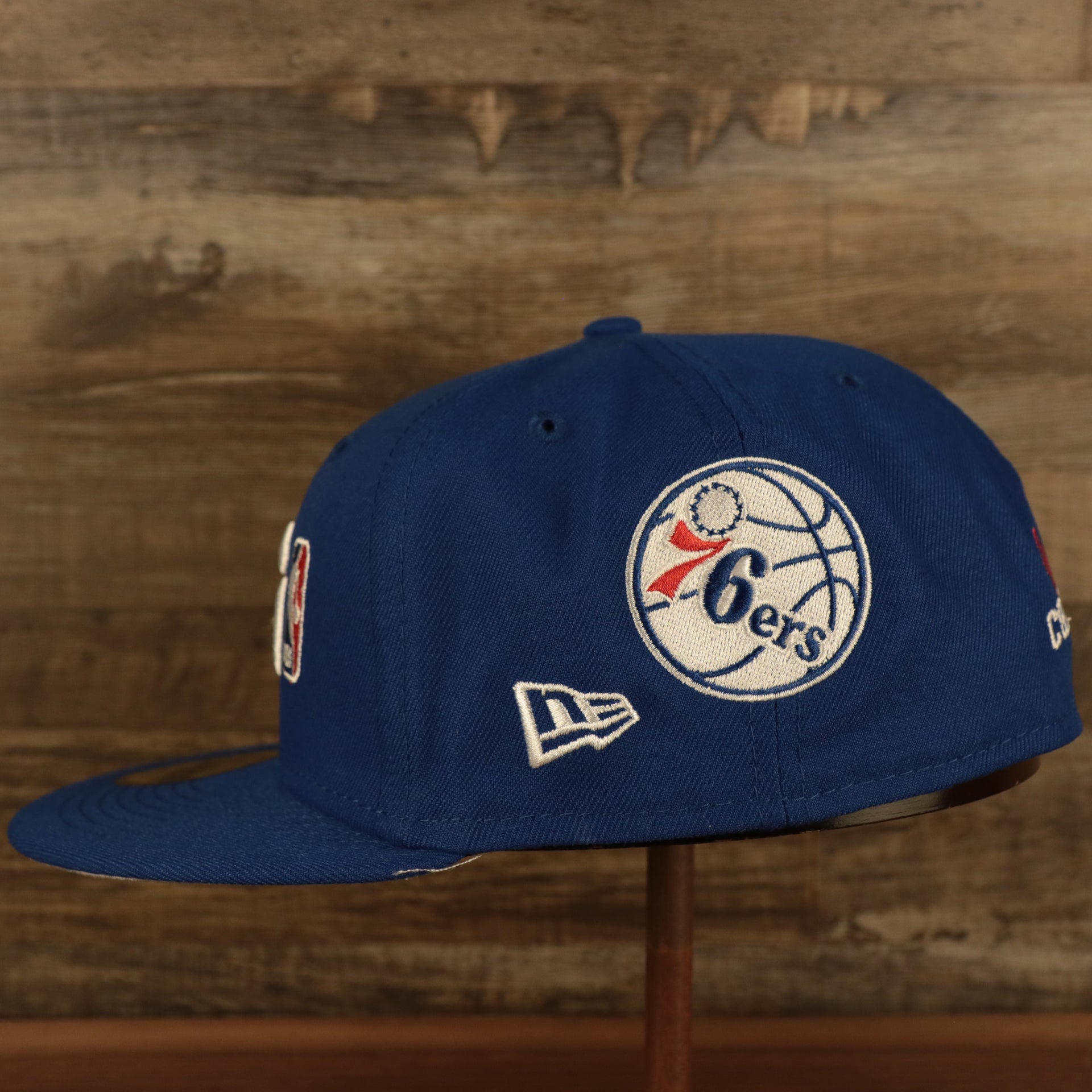 left side of Philadelphia 76ers "Championship Rings" All Over Side Patch Gray Bottom 59FIFTY Fitted Cap