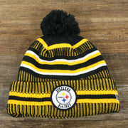 The front of the Pittsburgh Steelers On Field Sideline Cuffed Winter Knit Pom Pom Beanie | Yellow Winter Beanie