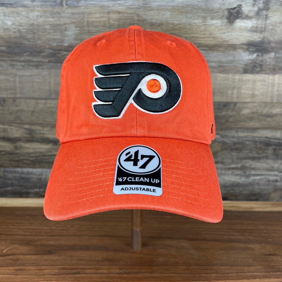 front of the Philadelphia Flyers Orange Adjustable Dad Hat