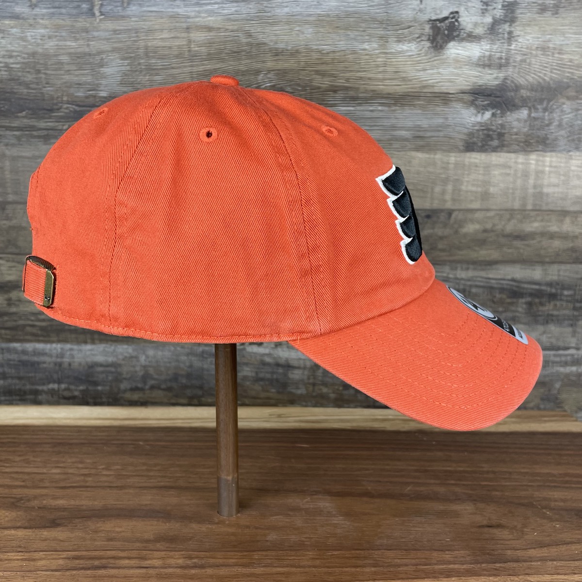 wearers right side of the Philadelphia Flyers Orange Adjustable Dad Hat