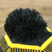 The Black Pom Pom on the Pittsburgh Steelers On Field Sideline Cuffed Winter Knit Pom Pom Beanie | Yellow Winter Beanie