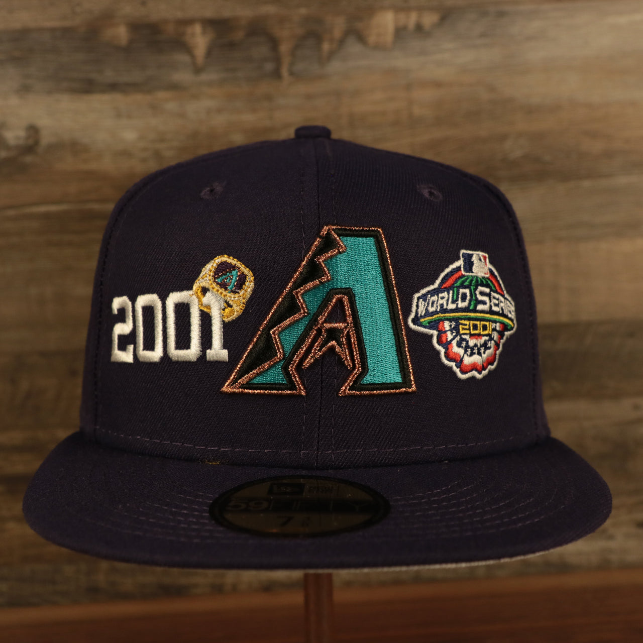 front of the Arizona Diamondbacks Cooperstown "Championship Rings" All Over Side Patch Gray Bottom 59FIFTY Fitted Cap