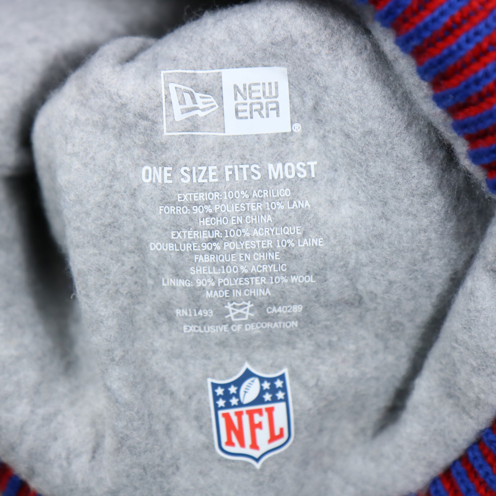 The Tags on the New York Giants On Field Sideline Cuffed Winter Knit Pom Pom Beanie | Red Winter Beanie