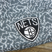 The Brooklyn Nets Logo on the Brooklyn Nets Jordan 3 Matching Concrete Print Winter Beanie With Pom Pom | Gray Winter Beanie