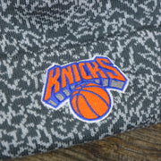 The Knicks Logo on the New York Knicks Jordan 3 Matching Concrete Print Winter Beanie With Pom Pom | Gray Winter Beanie