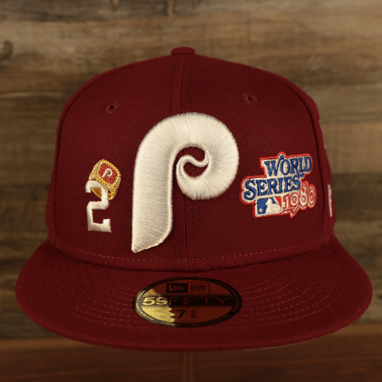 front of the Philadelphia Phillies Cooperstown "Championship Rings" All Over Side Patch Gray Bottom 59FIFTY Fitted Cap