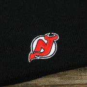 The New Jersey Devils Logo on the Kid’s New Jersey Devils Basic Cuffed Winter Beanie | Black Winter Beanie