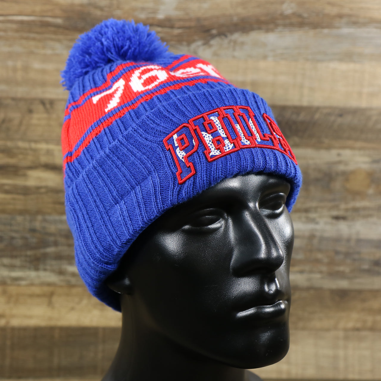 The Philadelphia 76ers Knit Wordmark Phila Arch Lettering Join Or Die Snake NBA Draft Striped Beanie | Royal Blue and Red Beanie