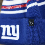 The 47 Brand Tag on the Kid’s New York Giants Striped Pom Pom Winter Beanie | Royal Blue, Red, And White Beanie