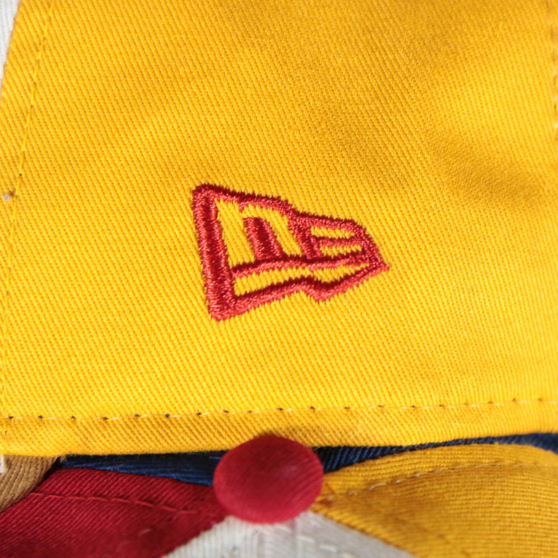 new era logo on the Jersey Shore Blueclaws Bucket Blueclaw MiLB Tan bottom 4 Tone | White/Red/Tan/Royal 9Twenty Dad Hat