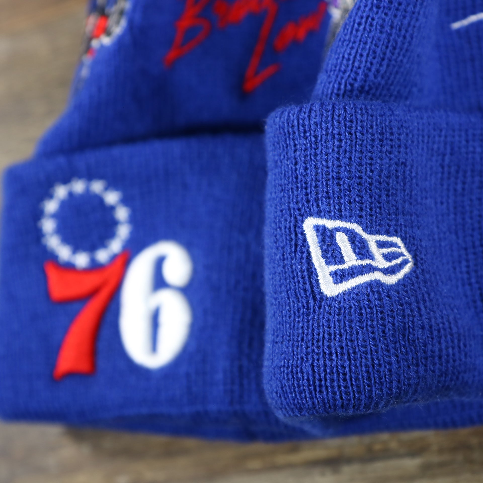 The New Era Logo on the Philadelphia 76ers "City Transit" 59Fifty Fitted Matching All Over Side Patch Beanie