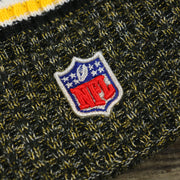 The NFL Logo on the Pittsburgh Steelers On Field Cold Weather Striped Wordmark Pom Pom Winter Beanie | Black and Yellow Beanie
