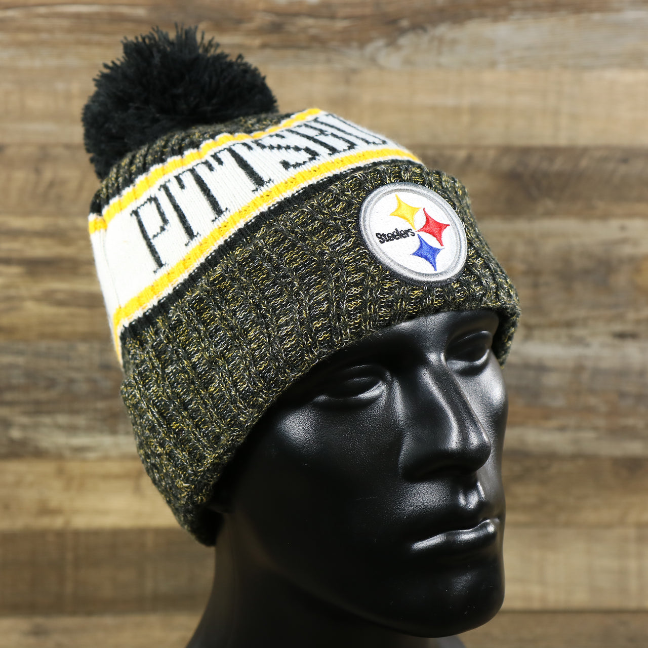 The Pittsburgh Steelers On Field Cold Weather Striped Wordmark Pom Pom Winter Beanie | Black and Yellow Beanie